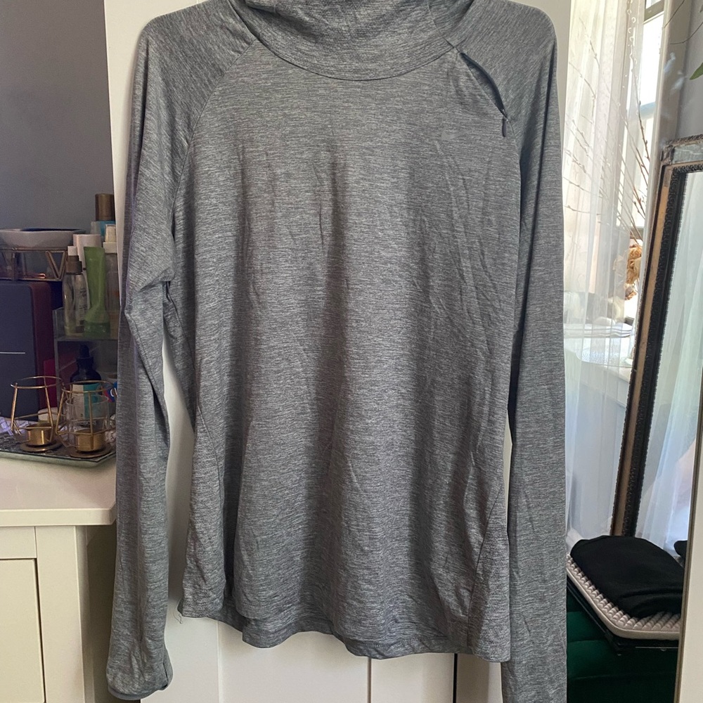 Nike gray long sleeve light weight hoodie. Dry fit with thumb hole. Size L.